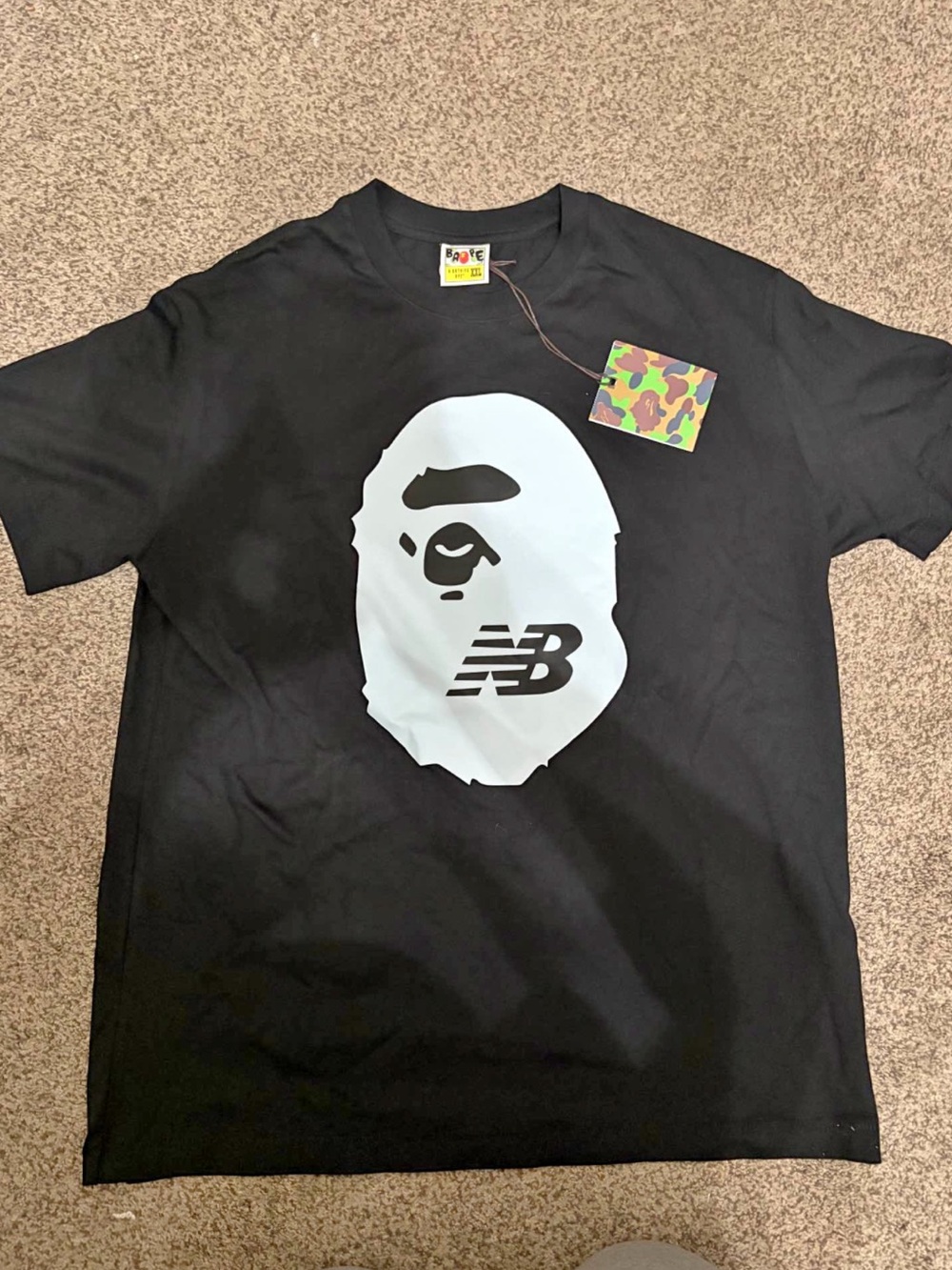 New Balance x BAPE Black Tee with Large White Ape Face Graphic